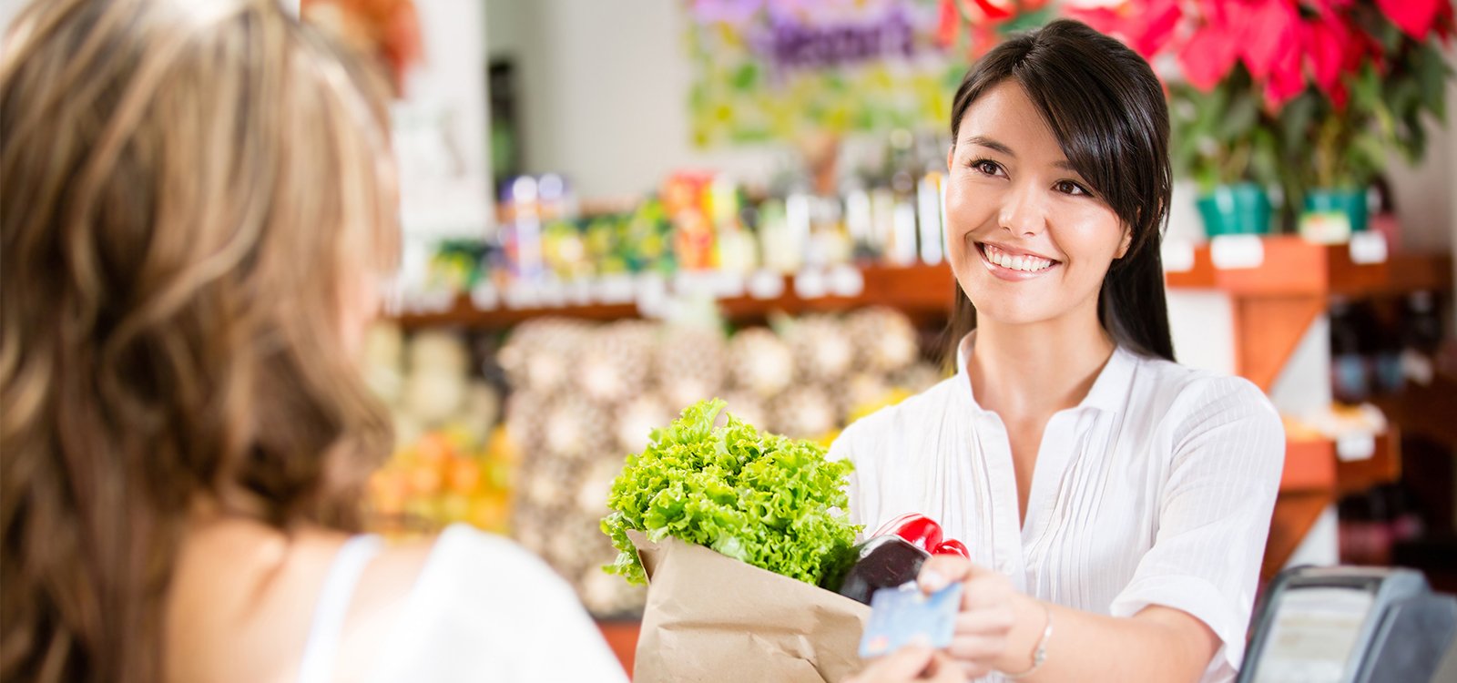 woman-buying-groceries-with-card