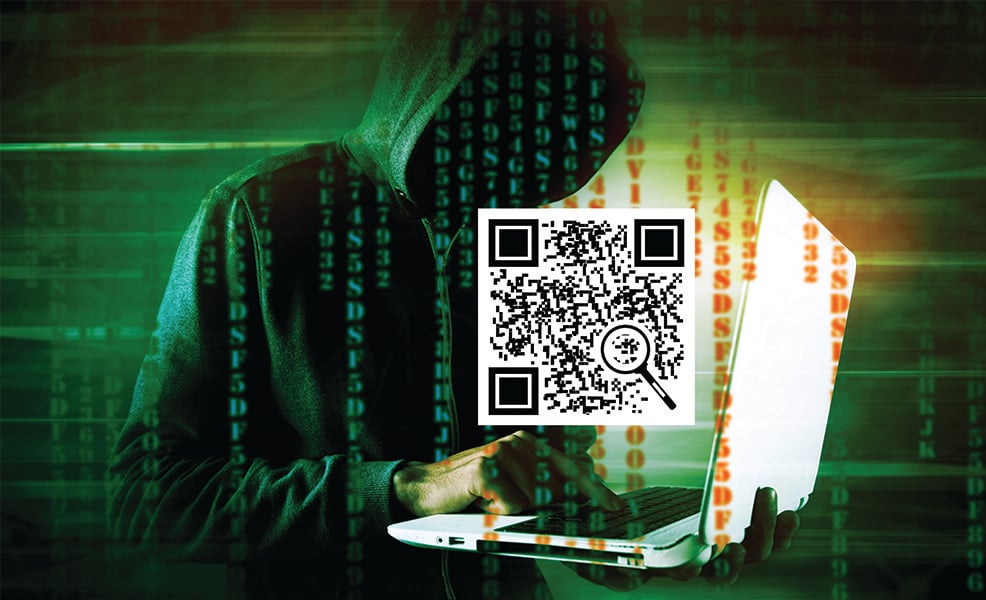 Hacker holding laptop with a QR code